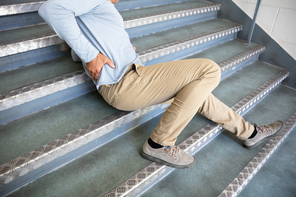 Photo of a Man Lying on Staircase